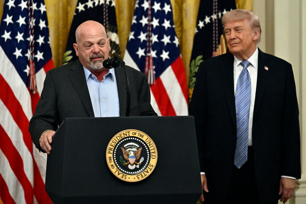 US President Donald Trump listens to US businessman and reality TV star Rick Harrison as he participates in a Small Business Summit in the East Room of the White House.