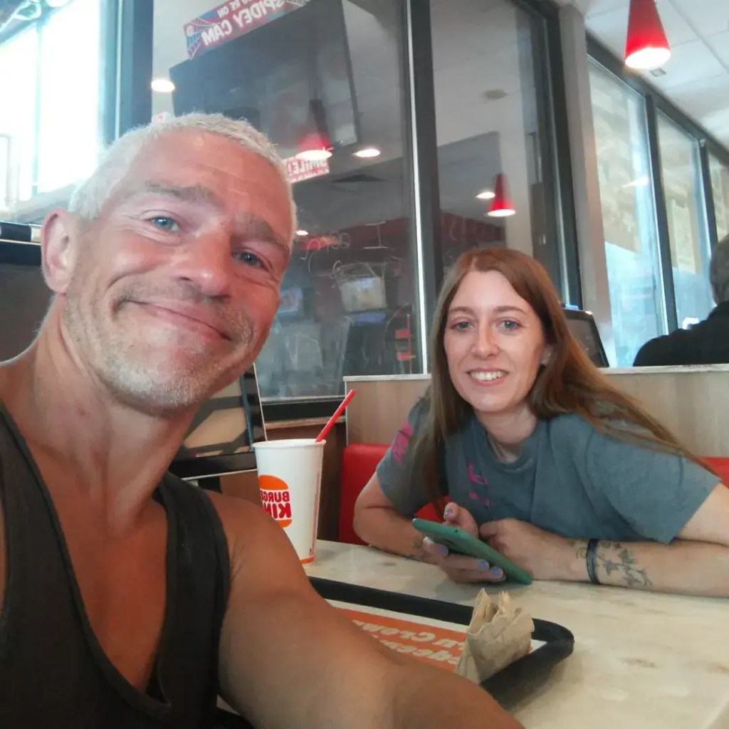 Matt Brown of Alaskan Bush People with a woman in a restaurant.