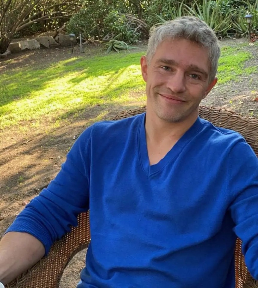 Matt Brown smiling in a backyard.