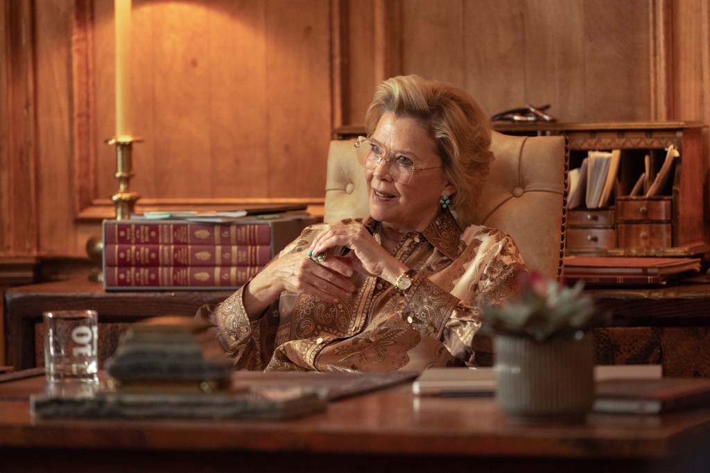 Annette Bening as Beulah Jackson, seated at a desk.