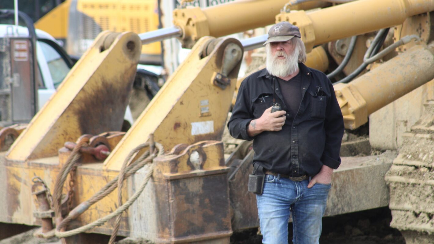 Tony Beets stood in front of machinery